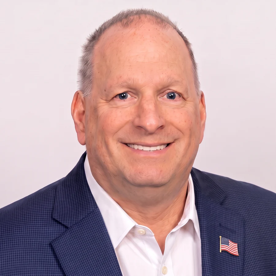 Dan Devine, founder of American Civic Power, wearing an American flag lapel pin